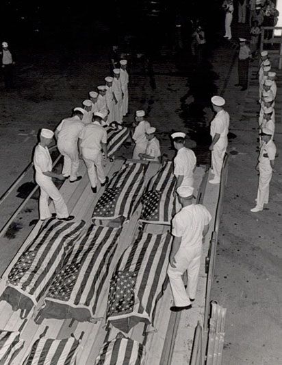 The cost sailors carefully lowered the first of their shipmates