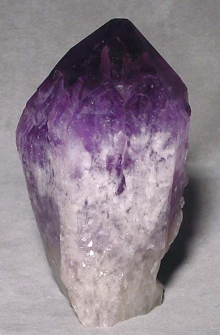 This Ametrine natural crystal point is a gorgeous purple color imbued
